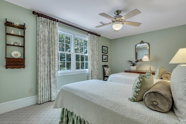 living room featuring light colored carpet and ceiling fan