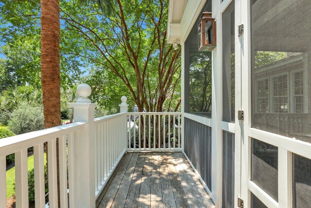 balcony featuring a porch and ceiling fan