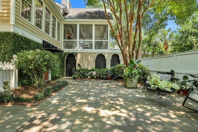 balcony featuring a porch and ceiling fan