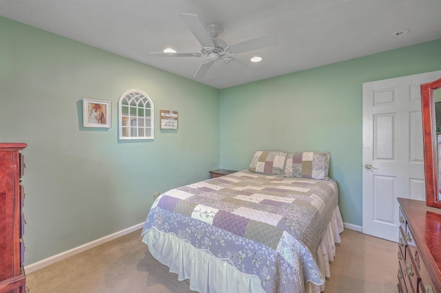 bedroom with light carpet, ceiling fan, baseboards, and recessed lighting