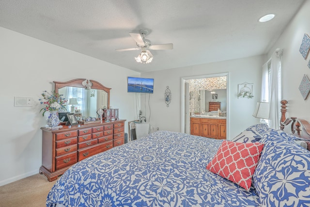 bedroom featuring carpet floors, ceiling fan, a textured ceiling, and baseboards