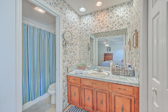 full bath with wallpapered walls, toilet, ensuite bath, tile patterned floors, and vanity