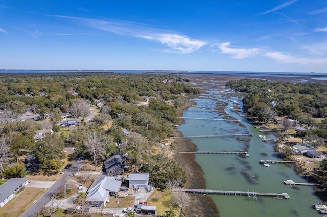 aerial view featuring a water view and a view of trees