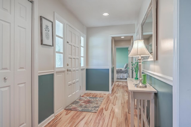 entryway featuring light wood-type flooring and recessed lighting