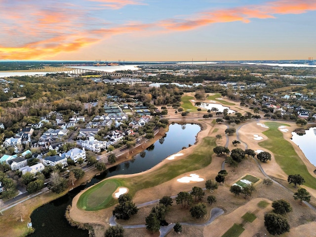 aerial view at dusk with a water view