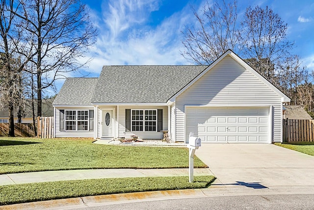 view of front of house with a garage and a front lawn