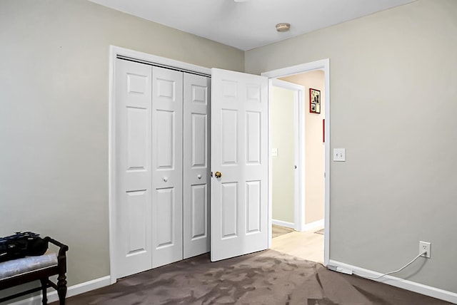 bedroom with carpet floors and a closet