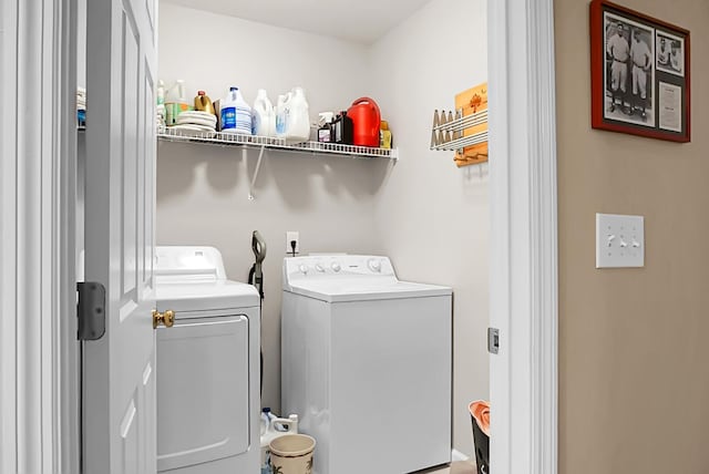 laundry room featuring separate washer and dryer