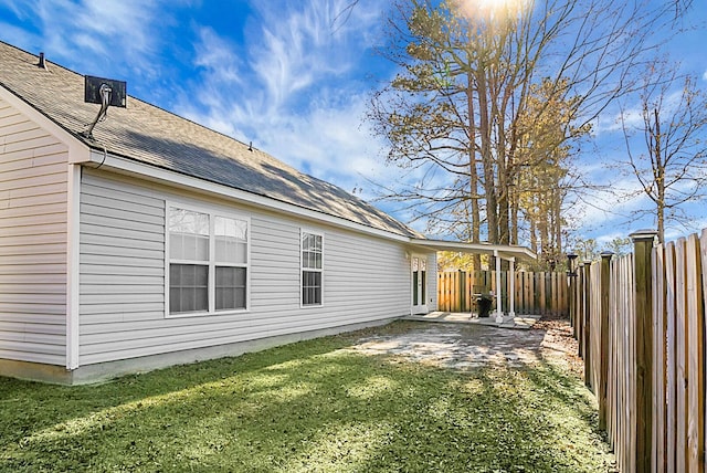 view of home's exterior featuring a yard and a patio area