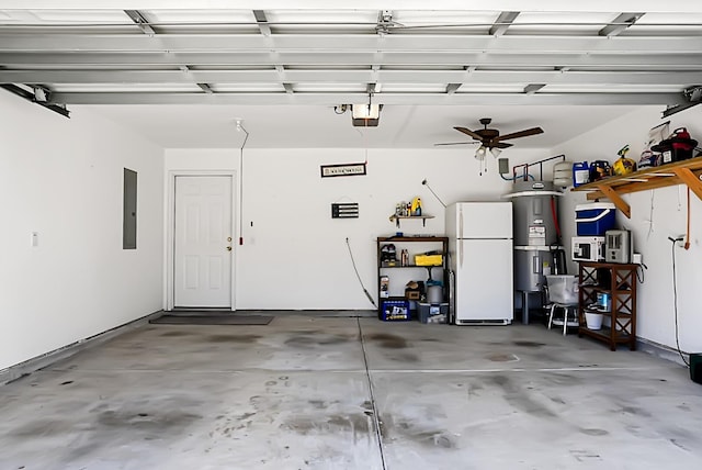 garage with ceiling fan, strapped water heater, a garage door opener, and white refrigerator