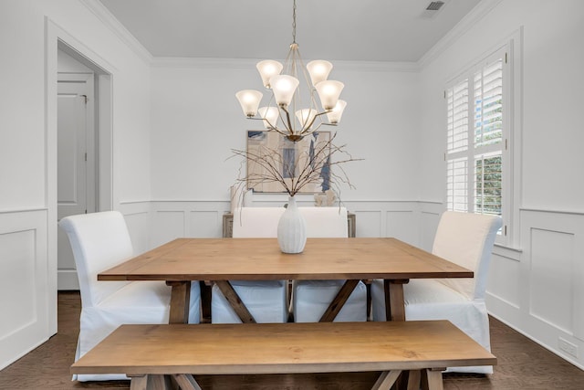 dining space with crown molding, a chandelier, and dark hardwood / wood-style floors