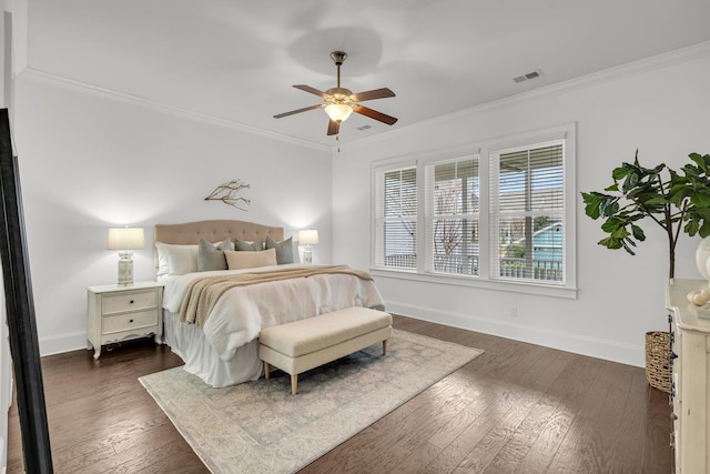 bedroom featuring ceiling fan, crown molding, and dark hardwood / wood-style floors