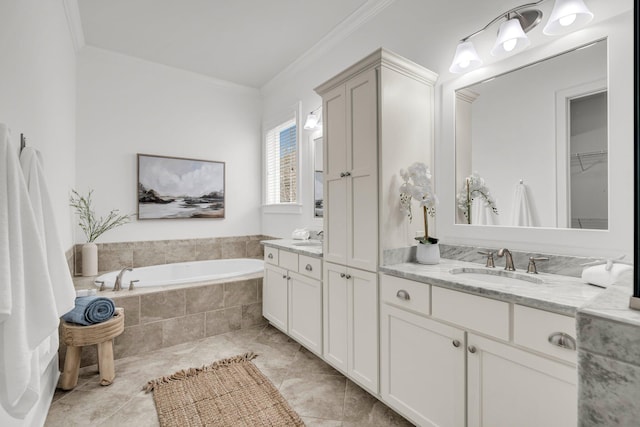 bathroom with ornamental molding, tiled tub, and vanity