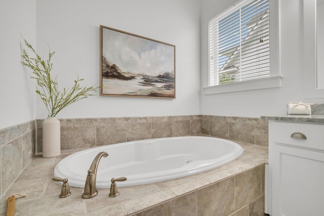 bathroom with tiled bath