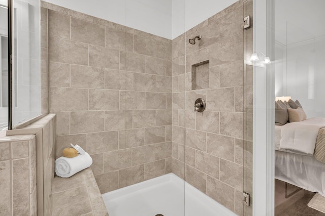 bathroom with tiled shower