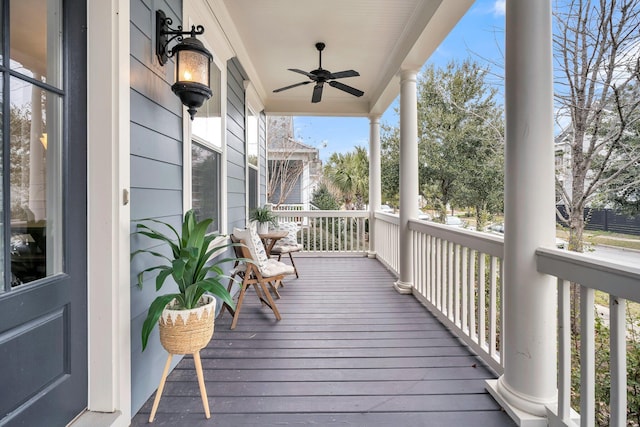 wooden terrace featuring ceiling fan