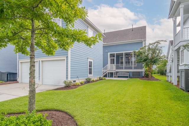 exterior space with a lawn, a sunroom, and a garage