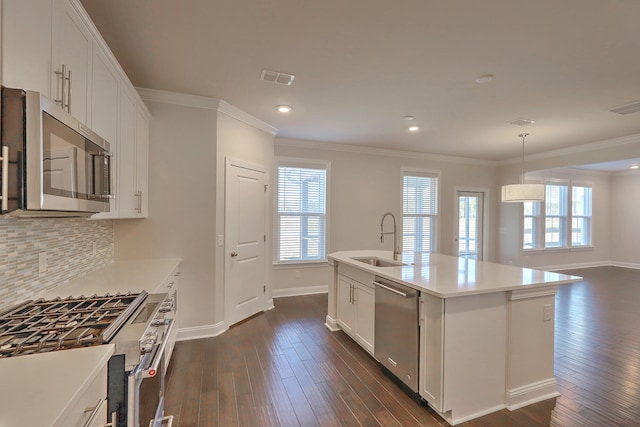 kitchen featuring appliances with stainless steel finishes, backsplash, dark hardwood / wood-style floors, and sink