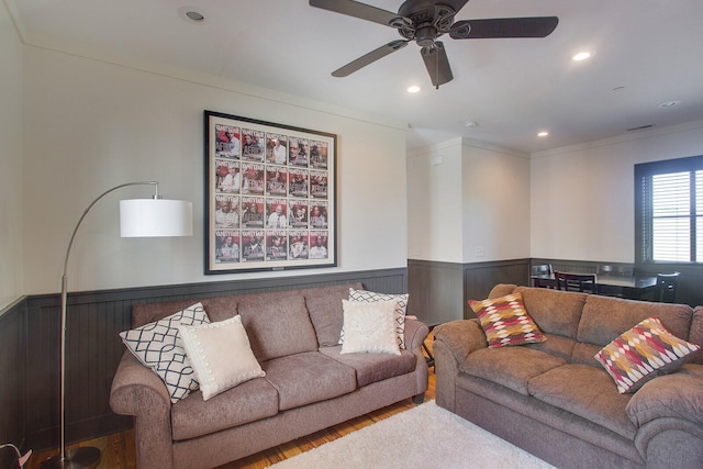 living room featuring light hardwood / wood-style floors and ceiling fan