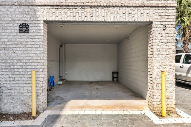 garage featuring a carport