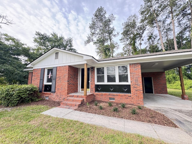 105 Dandridge Rd, Walterboro, SC 29488 - ranch-style house with concrete driveway, a front lawn, and brick siding