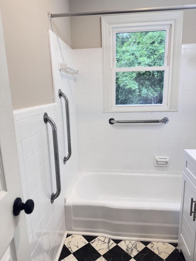105 Dandridge Rd, Walterboro, SC 29488 - full bath featuring tile walls, vanity, wainscoting, and shower / bath combination