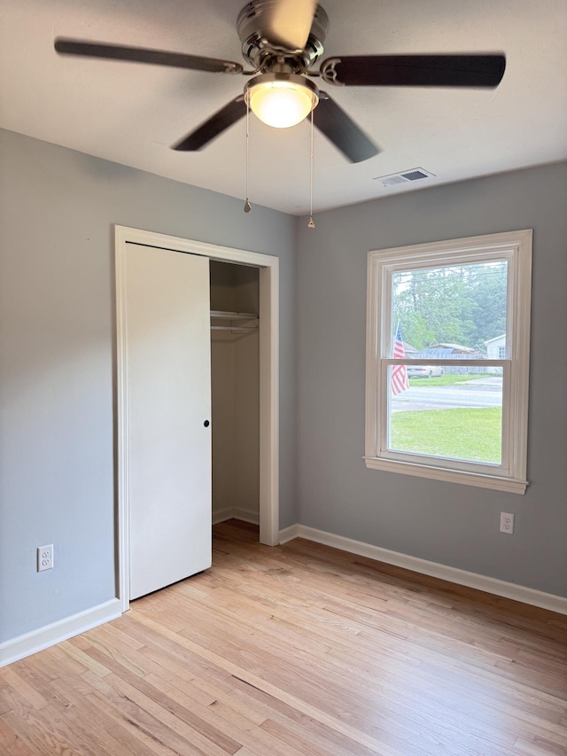 105 Dandridge Rd, Walterboro, SC 29488 - unfurnished bedroom featuring light wood-type flooring, a closet, a ceiling fan, and baseboards
