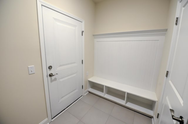 mudroom with light tile patterned flooring