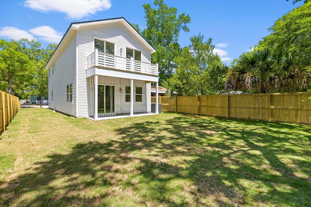 1917 Jason St, North Charleston, SC 29406 - back of house with a lawn, a fenced backyard, a balcony, and cooling unit
