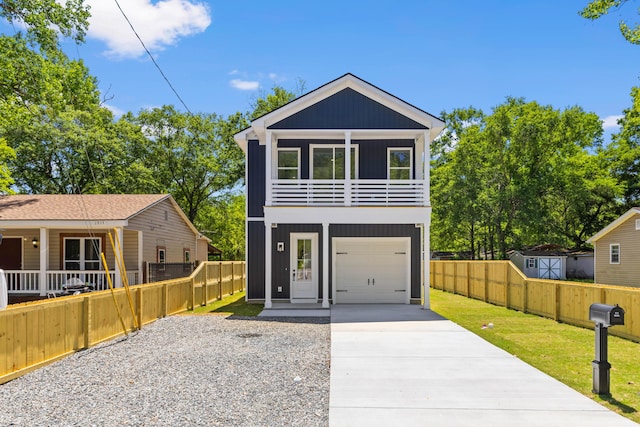 1917 Jason St, North Charleston, SC 29406 - coastal inspired home with fence private yard, a front lawn, a balcony, and concrete driveway