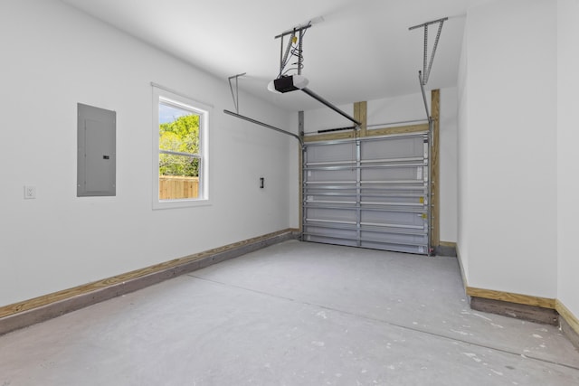 1917 Jason St, North Charleston, SC 29406 - garage with baseboards, a garage door opener, and electric panel