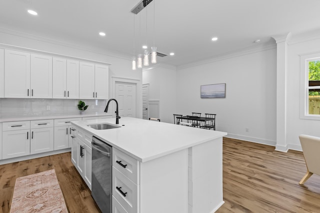 1917 Jason St, North Charleston, SC 29406 - kitchen with crown molding, a center island with sink, dishwasher, a sink, and light countertops