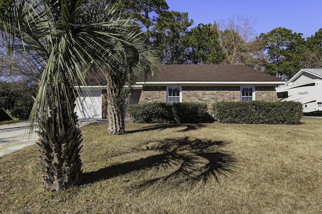 view of front facade with a front lawn and a garage