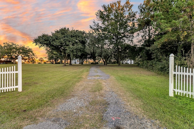 view of yard at dusk