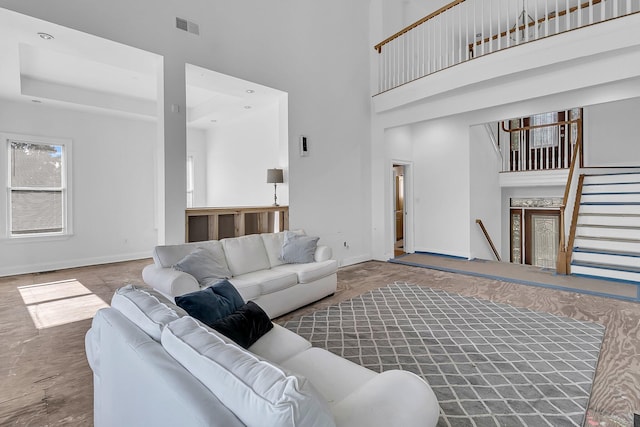 living room with a towering ceiling