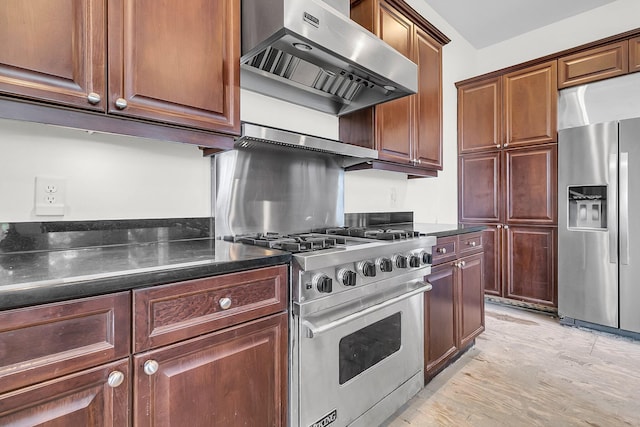 kitchen featuring extractor fan, appliances with stainless steel finishes, and light hardwood / wood-style flooring