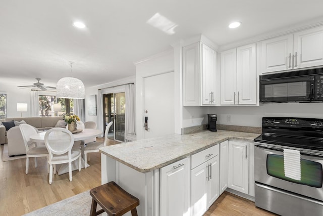 kitchen with white cabinetry, stainless steel electric stove, light stone counters, and kitchen peninsula