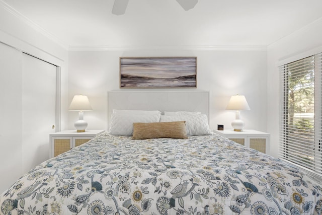 bedroom featuring ornamental molding, a closet, and ceiling fan