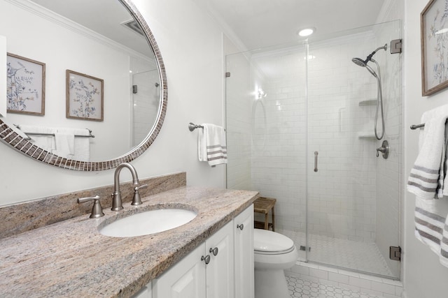 bathroom featuring crown molding, vanity, toilet, and an enclosed shower