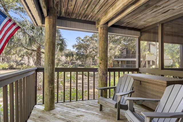 unfurnished sunroom featuring wooden ceiling