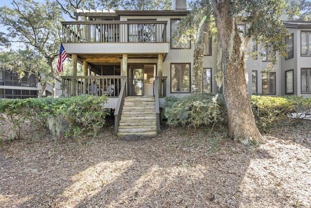 view of front of home with a balcony