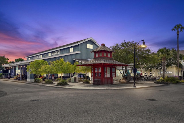 view of outdoor building at dusk