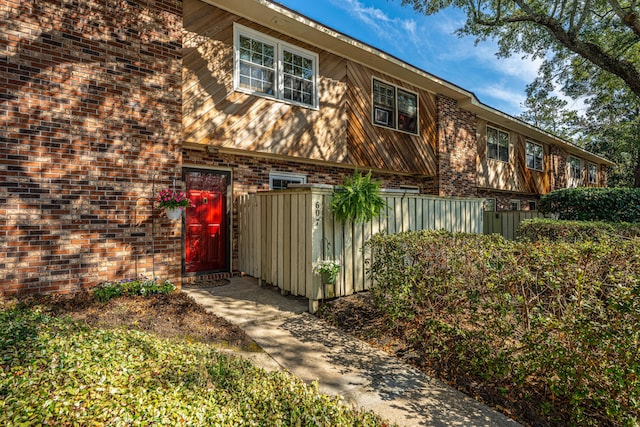 view of side of property with brick siding