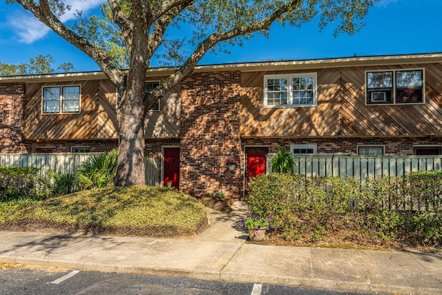 view of property featuring brick siding