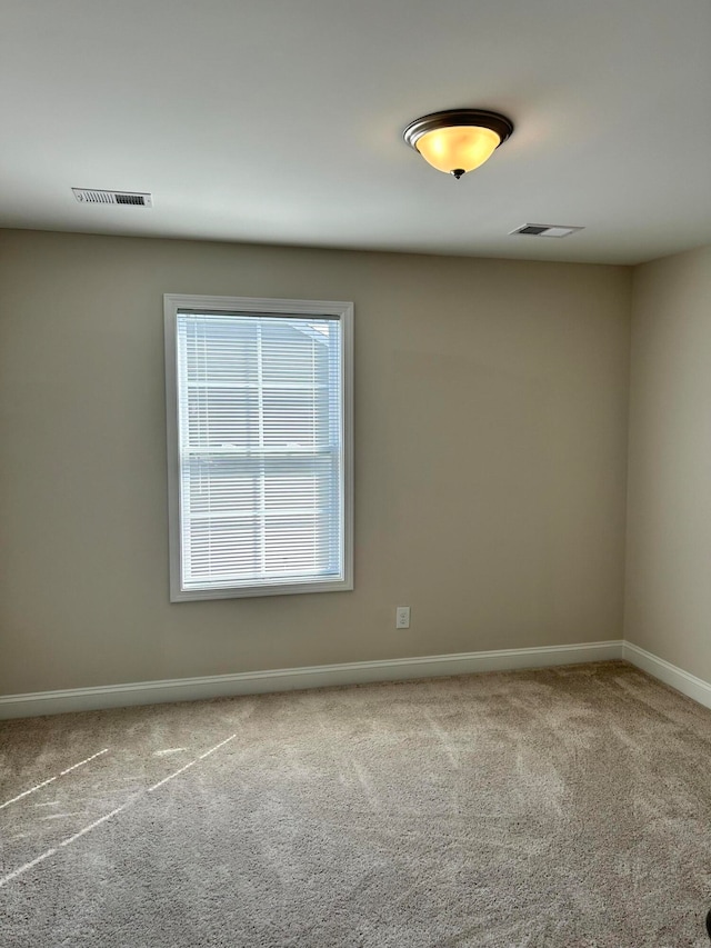 unfurnished room featuring carpet flooring