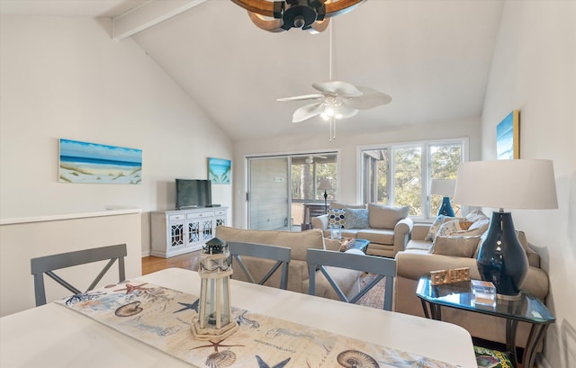 dining space featuring ceiling fan, hardwood / wood-style floors, high vaulted ceiling, and beamed ceiling