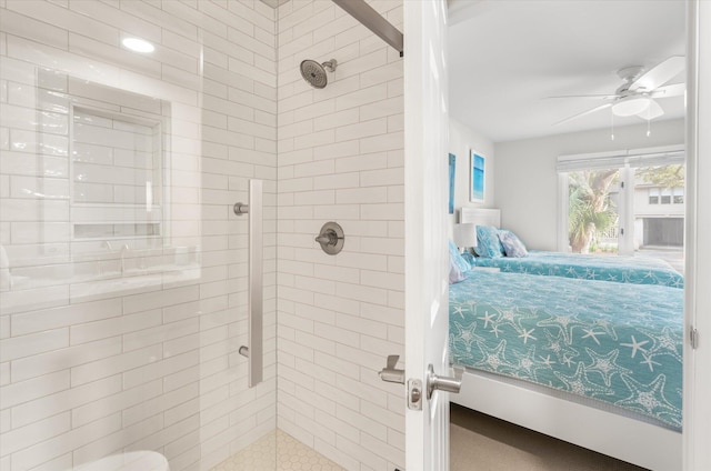 bathroom with ceiling fan and a tile shower