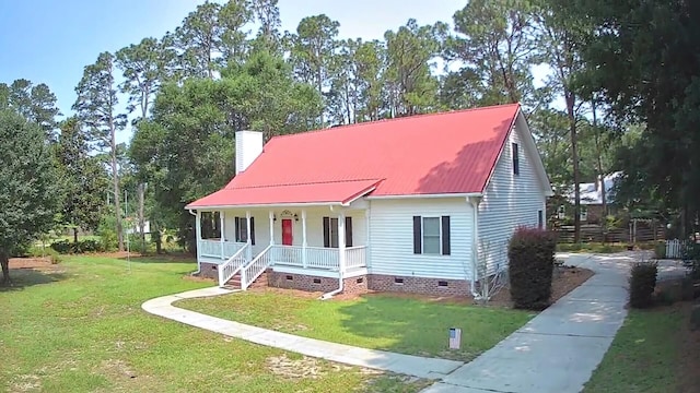 236 Chamblee Rd, Walterboro, SC 29488 - view of front facade with crawl space, a porch, a front lawn, and metal roof