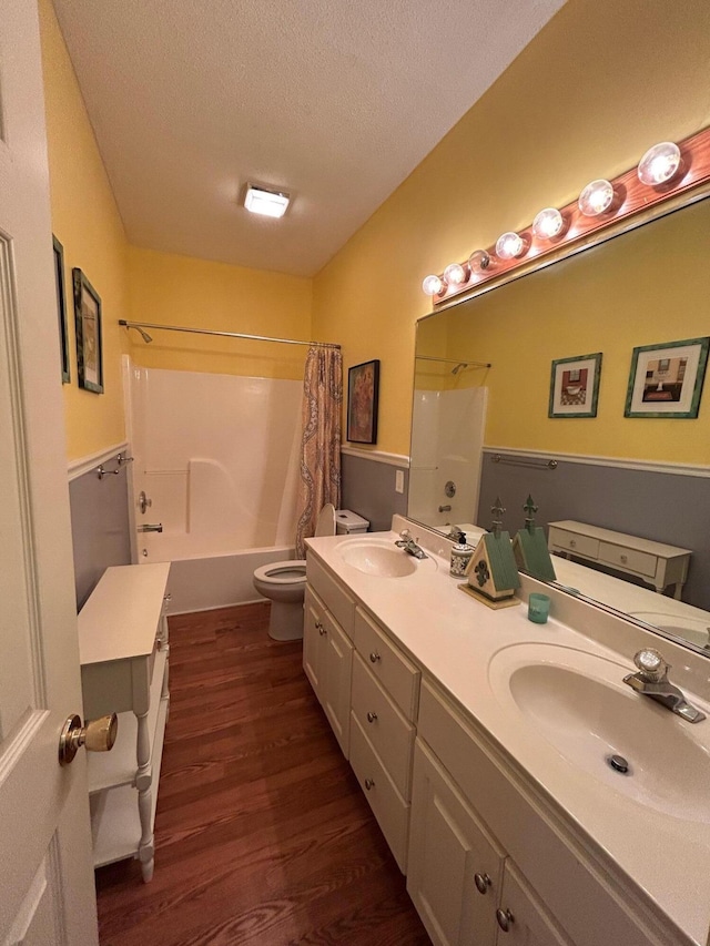 236 Chamblee Rd, Walterboro, SC 29488 - full bath with toilet, wood finished floors, shower / tub combo with curtain, double vanity, and a textured ceiling
