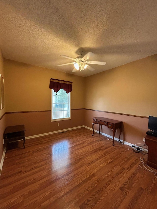 236 Chamblee Rd, Walterboro, SC 29488 - unfurnished room featuring ceiling fan, wood finished floors, a textured ceiling, and baseboards